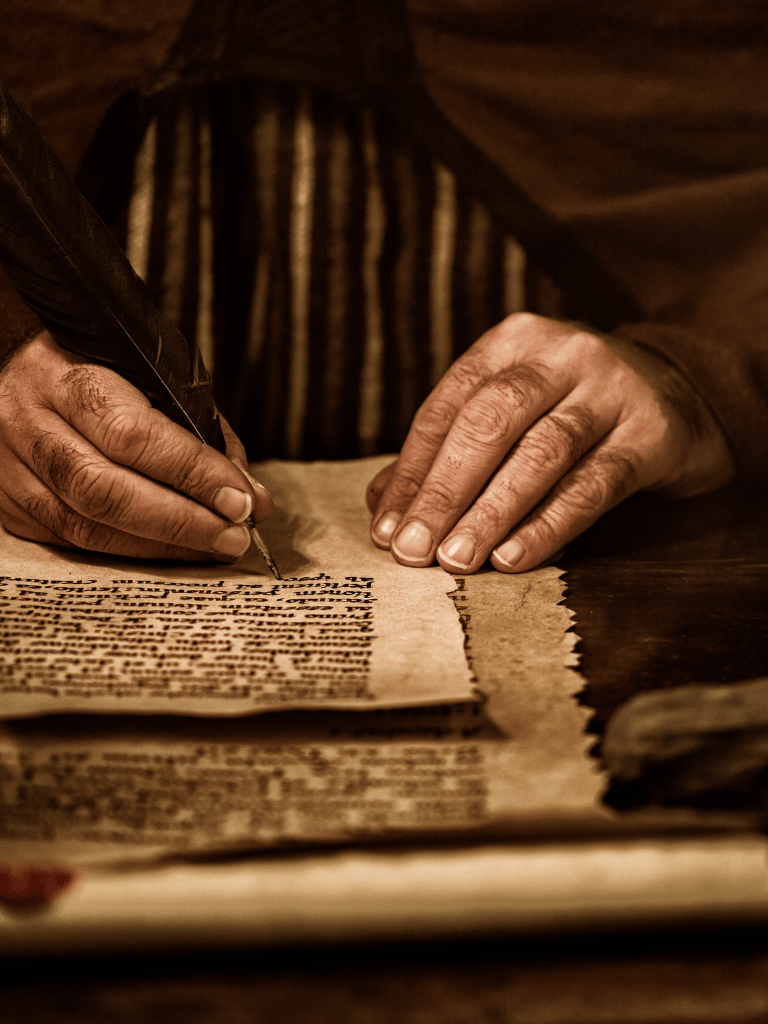 ancient scribe writing in candlelight